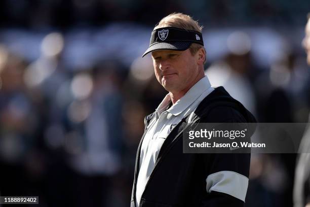 Head coach Jon Gruden of the Oakland Raiders watches his team warm up before the game against the Jacksonville Jaguars at RingCentral Coliseum on...