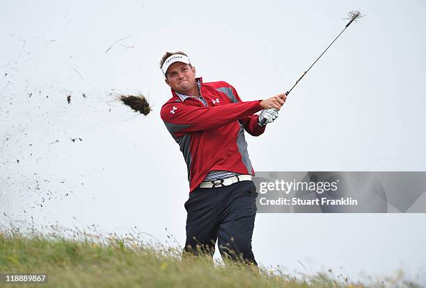 Jeff Overton of the USA hits from the rough during the second practice round during The Open Championship at Royal St. George's on July 12, 2011 in...