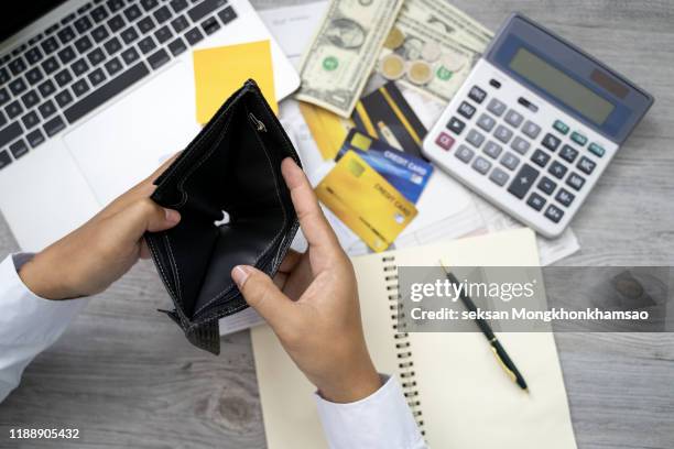 poor asian woman hand open empty purse looking for money having problem bankrupt broke after credit card payday - bancarrota fotografías e imágenes de stock