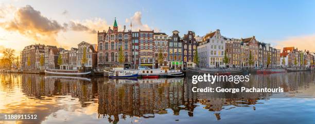 sunrise panorama in amsterdam, the netherlands - amstel stock pictures, royalty-free photos & images
