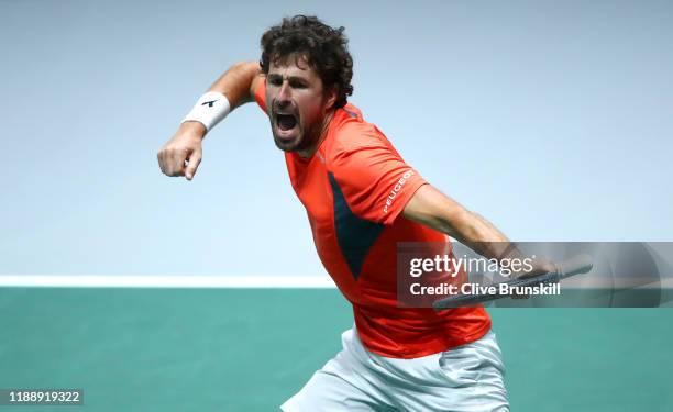 Robin Haase of the Netherlands celebrates match point and victory during his Davis Cup Group Stage match against Daniel Evans of Great Britain during...