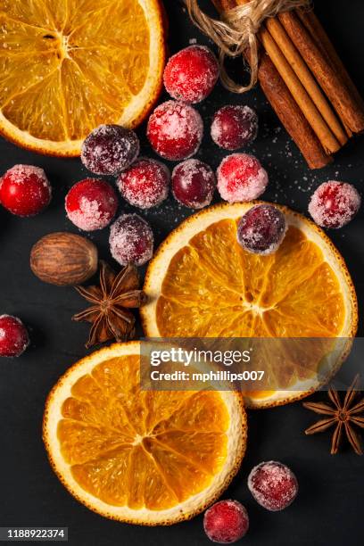 cranberries, dried oranges, and spice for the holidays - candied oranges stock pictures, royalty-free photos & images