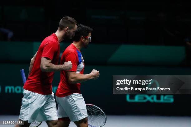 Janko Tipsarevic and Viktor Troicki of Serbia celebrate their victory after their doubles match played against Ben McLachlan and Yasutaka Uchiyama of...