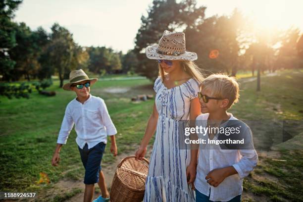 three kids returning from picnic - happy ending stock pictures, royalty-free photos & images