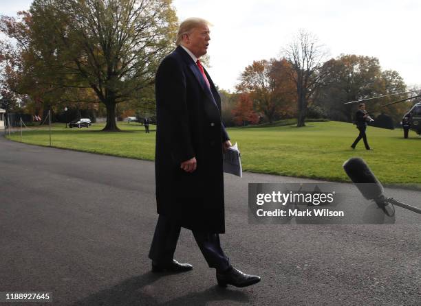 President Donald Trump speaks to the media before departing from the White House on November 20, 2019 in Washington, DC. President Trump spoke about...