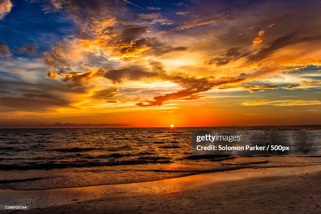 Landscape with beach and sea at sunset