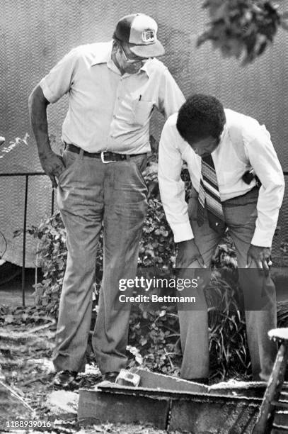 Homer Williams , father of Wayne B. Williams, charged in the slaying of Atlanta's 28th murder victim, watches as an Atlanta police officer looks in a...