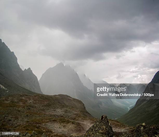 storm clouds over kodar mountains,  novaya chara, russia - novaya stock pictures, royalty-free photos & images