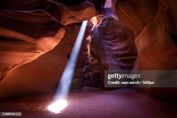 view of sunbeams rays into cave in antelope canyon, arizona, usa - antelope canyon stock-fotos und bilder