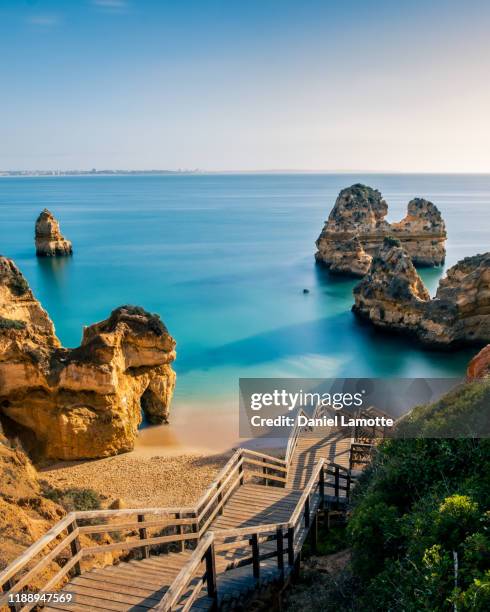 sand beach praia do camilo in algarve - faro stock-fotos und bilder