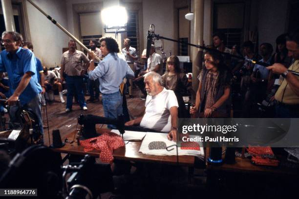 John Huston, director, prepares his crew for another scene of Annie a film released 1982 was an American musical comedy-drama film based on the...