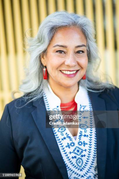 portrait of a happy mexican businesswoman - grey hair stock pictures, royalty-free photos & images