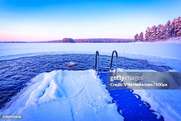 ice swimming place in kuhmo, finland - winter swimming stock pictures, royalty-free photos & images