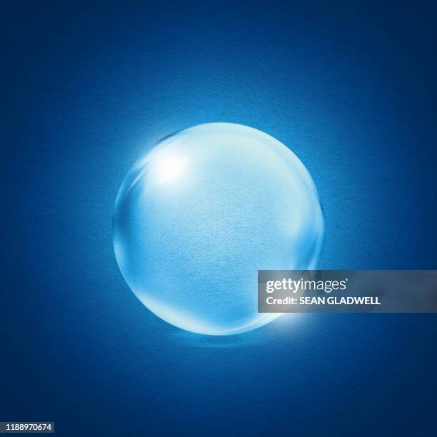 crystal ball on blue - sphere stock-fotos und bilder