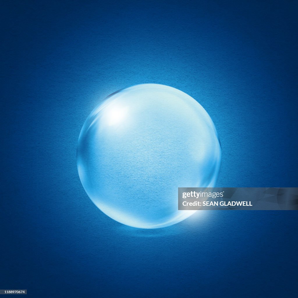 Crystal ball on blue