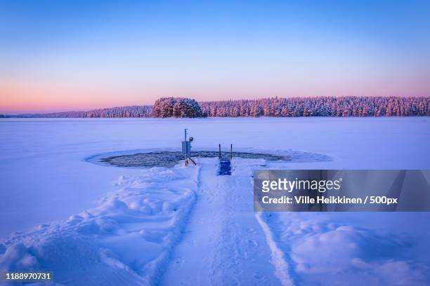 ice swimming place in kuhmo, finland - winter swimming stock pictures, royalty-free photos & images