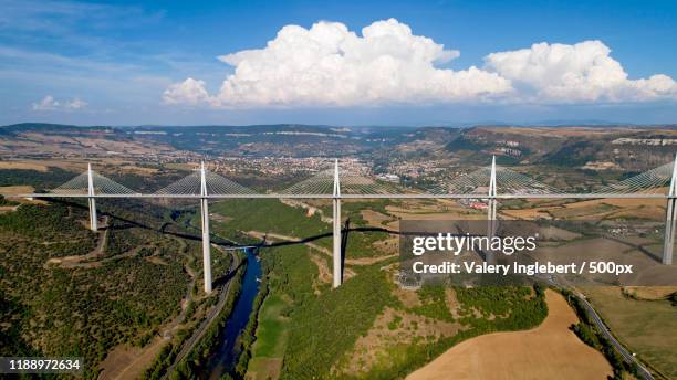 aerial view of millau city and viaduct - millau viaduct stock pictures, royalty-free photos & images