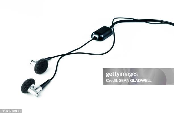 personal earphones - man and machine stock pictures, royalty-free photos & images