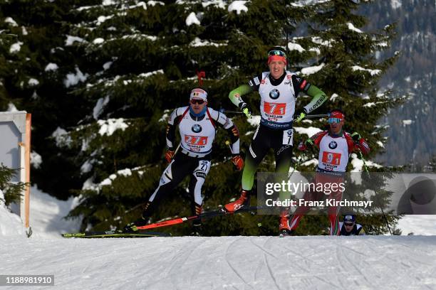 Florent Claude of Belgium Miha Dovzan of Slovenia and Krasimir Anev of Bulgaria competes during in the men 4x7.5 km Relay Competition at the BMW IBU...