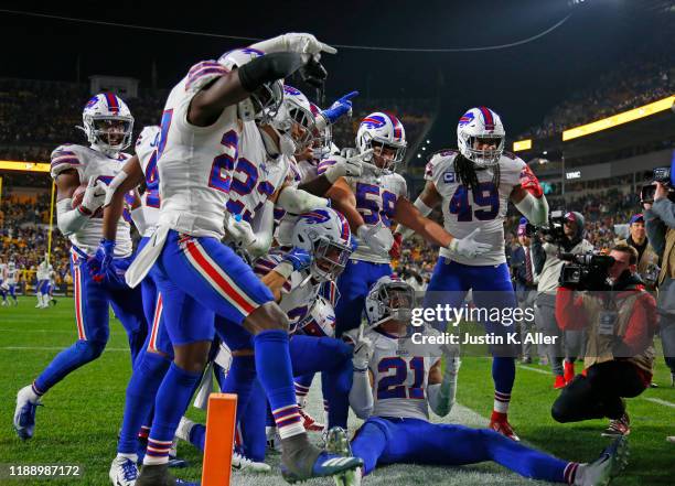 Levi Wallace of the Buffalo Bills celebrates with his defensive teammates after catching an interception in the fourth quarter against the Pittsburgh...