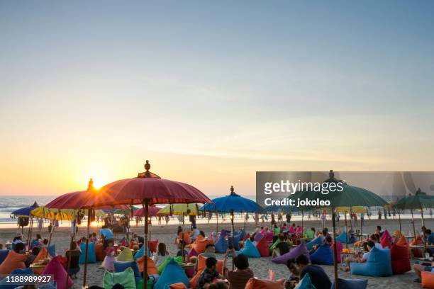enjoy sunset at seminyak (kuta and legian), bali - indonesia - bali beach ストックフォトと画像
