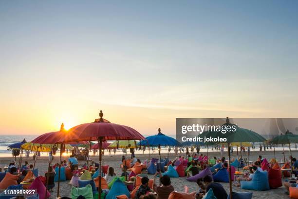 enjoy sunset at seminyak (kuta and legian), bali - indonesia - bali - fotografias e filmes do acervo