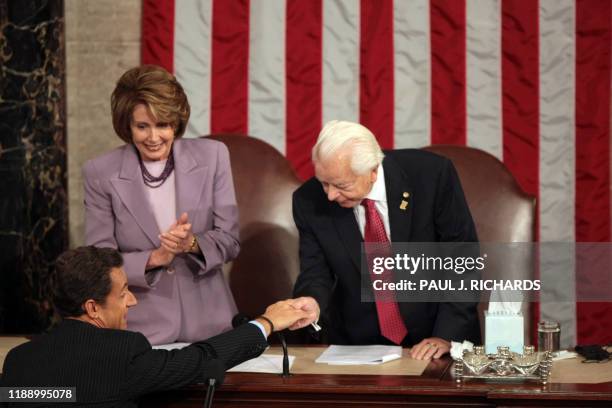 French President Nicolas Sarkozy greets US Speaker of the House Nancy Pelosi and Senator Robert Byrd before addressing the US Congress in Washington,...