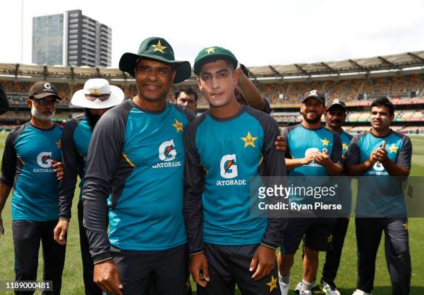 Naseem Shah of Pakistan reacts after receiving his test cap from Waqar Younis ahead of his debut during day one of the 1st Domain Test between...