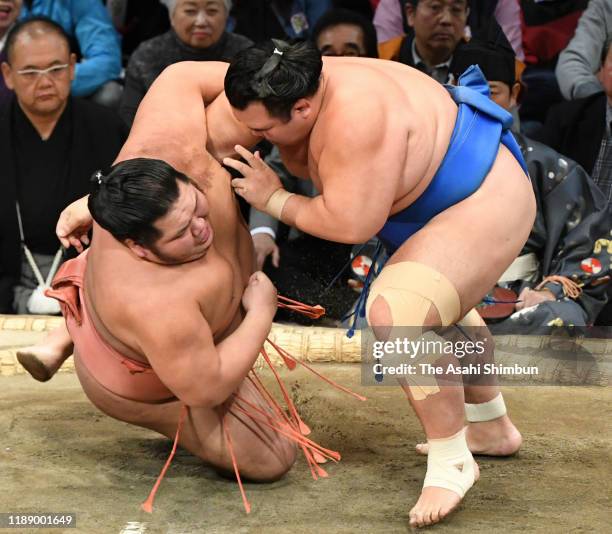 Kotoshogiku throws Chiyotairyu to win on day eleven of the Grand Sumo Kyushu Tournament at the Fukuoka Convention Centre on November 20, 2019 in...