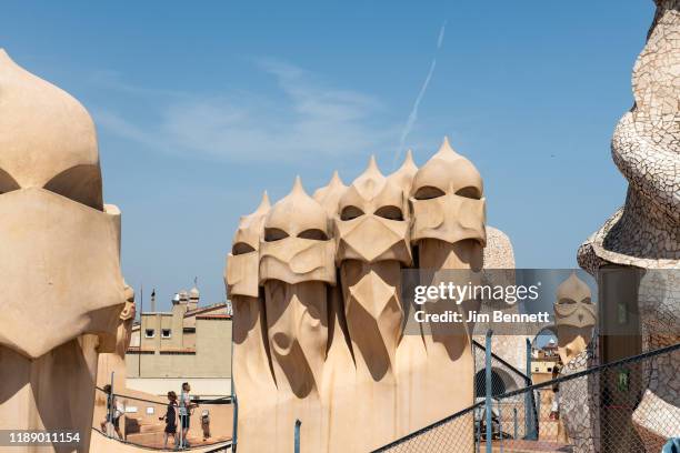 Rooftop sculptures sit atop Casa Mila, the curving walled apartment house designed by architect Antoni Gaudi, on June 25, 2019 in Barcelona, Spain.