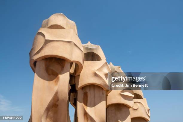 Rooftop sculptures sit atop Casa Mila, the curving walled apartment house designed by architect Antoni Gaudi, on June 25, 2019 in Barcelona, Spain.