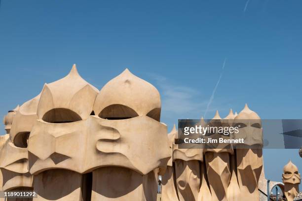 Rooftop sculptures sit atop Casa Mila, the curving walled apartment house designed by architect Antoni Gaudi, on June 25, 2019 in Barcelona, Spain.