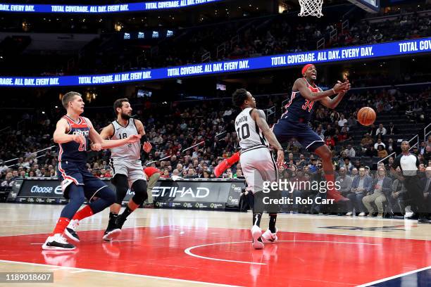Miles of the Washington Wizards looses control of the ball in front of DeMar DeRozan of the San Antonio Spurs in the first half at Capital One Arena...