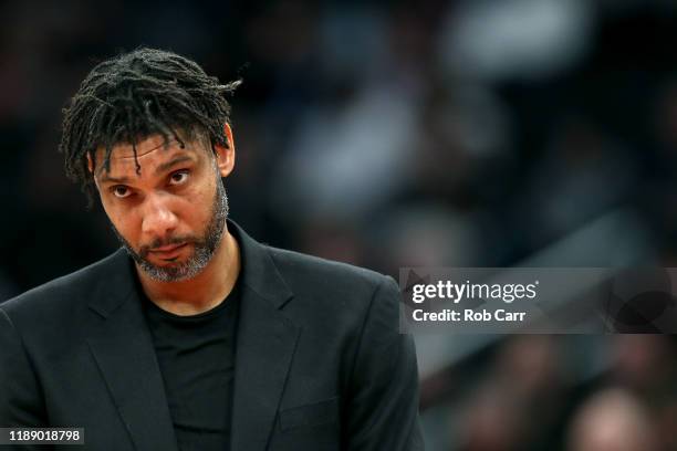 Assistant coach Tim Duncan of the San Antonio Spurs looks on in the first half against the Washington Wizards at Capital One Arena on November 20,...