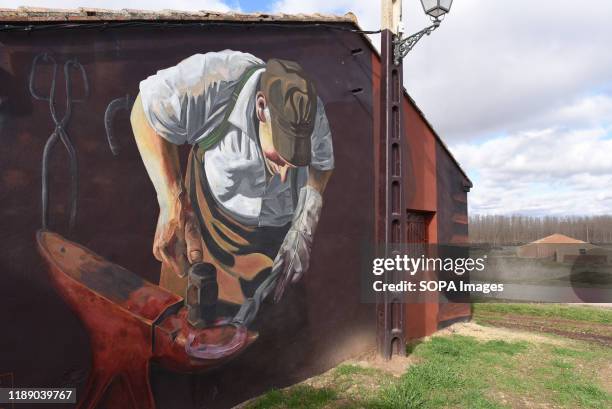 Graffiti painting on the wall in the village of Almarail, north of Spain. The neighbours of Almarail and Nomparedes, in Spanish province's Soria...