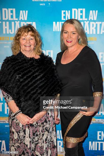 Inger Nilsson and guest pose for a picture on the red carpet during the premiere for "A Piece Of My Heart" at the Rigoletto cinema on December 16,...
