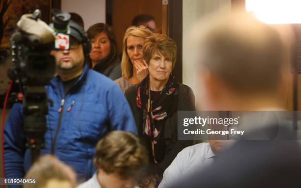 People watch from the hallway as Rep. Ben McAdams announces he will vote yes on both articles of Impeachment of President Trump when it comes to a...