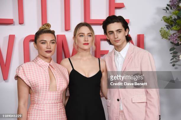 Florence Pugh, Saoirse Ronan and Timothee Chalamet pose at the evening photocall for "Little Women" at The Soho Hotel London on December 16, 2019 in...