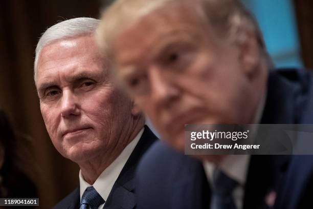 Vice President Mike Pence and U.S. President Donald Trump listen during a meeting about the Governors Initiative on Regulatory Innovation in the...