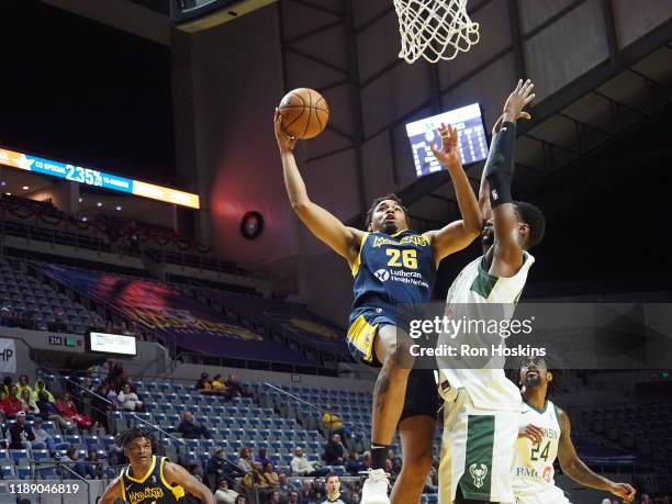 Ben Moore of the Fort Wayne Mad Ants shoots the ball against Brandon McCoy of the Wisconsin Herd on December 16, 2019 at Memorial Coliseum in Fort...