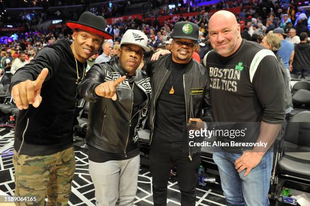 Ronnie DeVoe, Michael Bivins, Ricky Bell of Bell Biv DeVoe pose for a photo with Dana White after a basketball game between the Los Angeles Clippers...