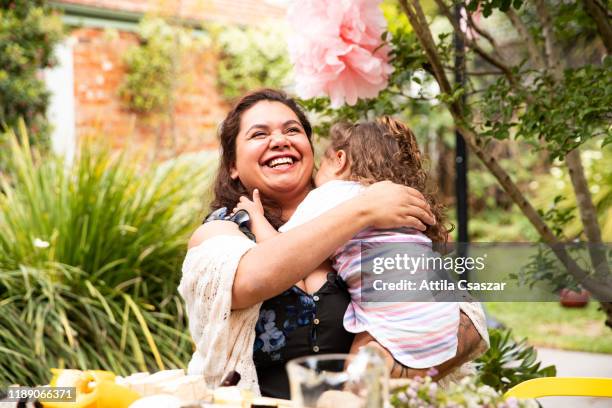 big laughs between mother and daughter in the garden - australian native flowers stock pictures, royalty-free photos & images