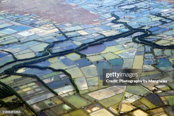 asian patchwork landscape - makassar stock pictures, royalty-free photos & images