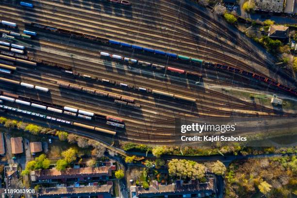 top view of colorful cargo trains. - level crossing stock pictures, royalty-free photos & images