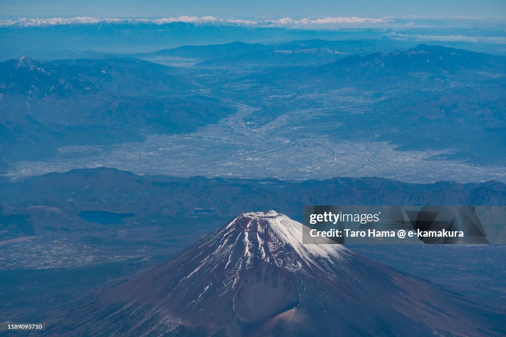 Snow-capped Mt. Fuji and Hida Mountains in Japan aerial view from airplane
