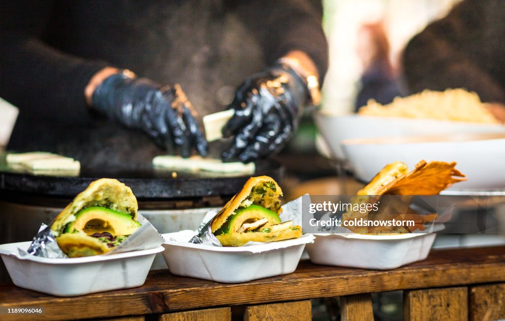 Fresh avocado wraps for sale at vegetarian stall at food market