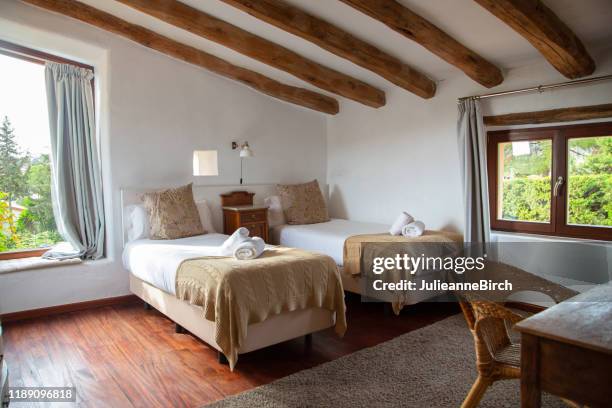 bedroom with views of garden in spanish farmhouse, barcelona - bedroom ceiling stock pictures, royalty-free photos & images