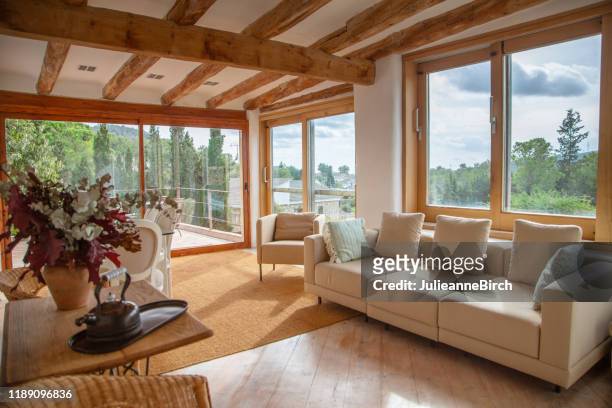 upper living room view on to garden, pool and courtyard of spanish farmhouse, barcelona - window stock pictures, royalty-free photos & images