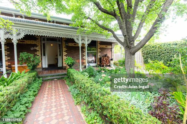 front yard of victorian style house - australia house stock-fotos und bilder