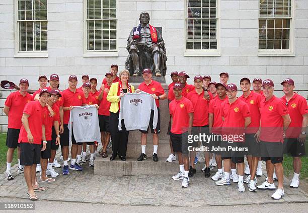 The Manchester United squad pose in front of a statue of Harvard founder John Harvard as part of their 2011 USA Tour at Harvard University on July...